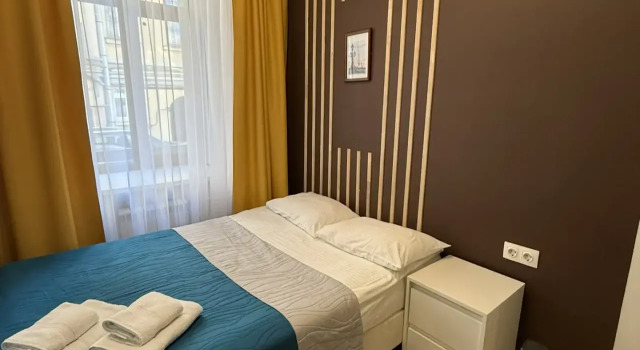 Меблированные комнаты Grand Apartments, Забронировать Апартаменты/квартира Отели Санкт-Петербурга с парковкой, рядом с Стрелка Васильевского острова, Парковка