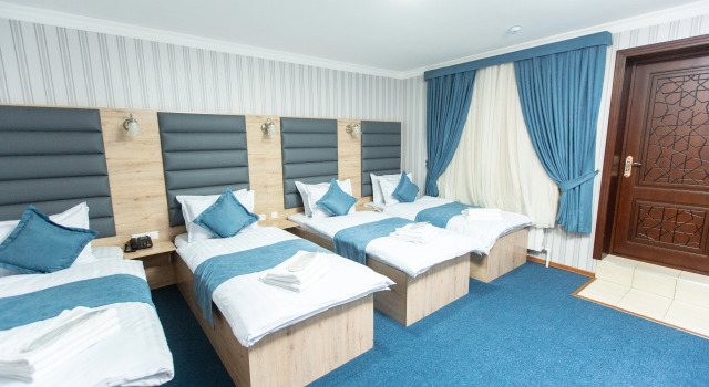 Четырёхместный номер с балконом и с красивым видом из окна Mirzo Boutique Hotel