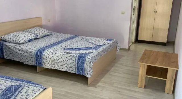 Кровать в общем номере Гостевой дом Новый Афон