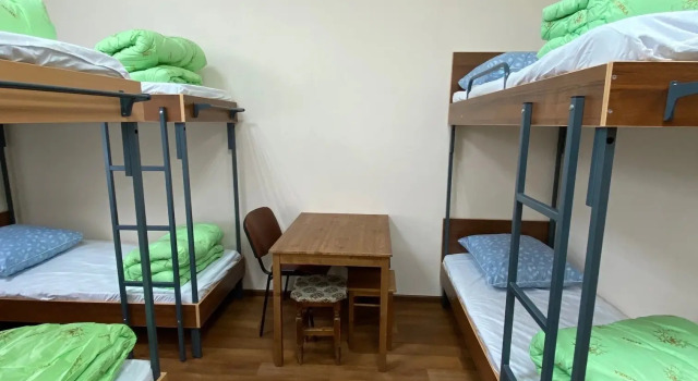 Кровать в общем номере Отель Визит