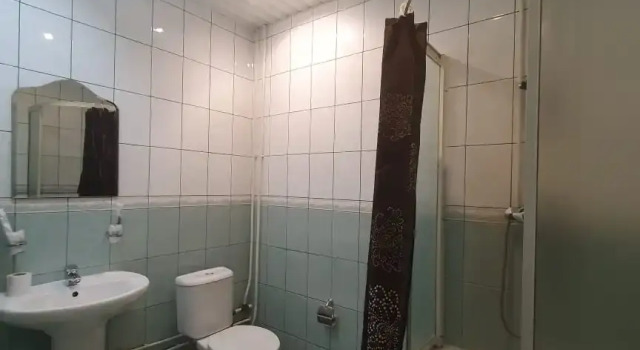 Кровать в общем номере ДОС Отель