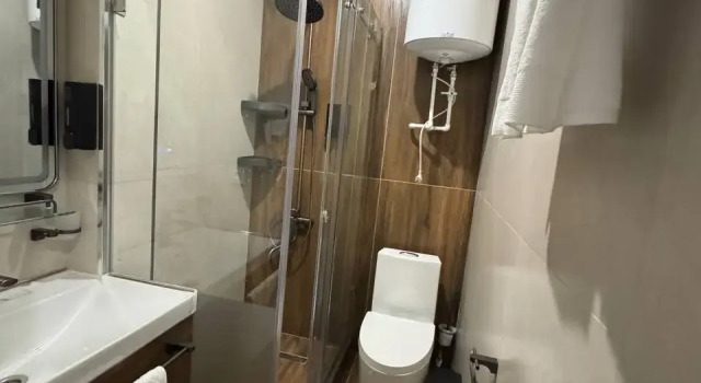 Кровать в общем номере с красивым видом из окна Отель Villa Osh