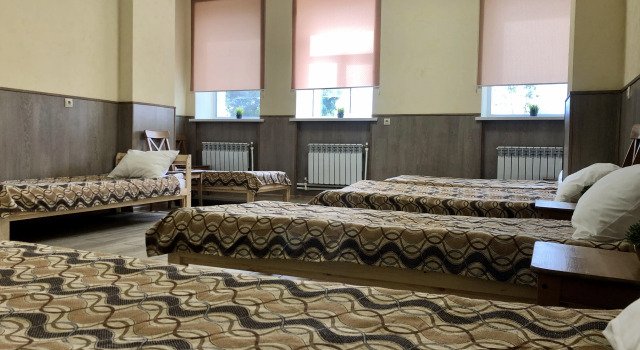 Кровать в общем номере Гостиница Атмосфера