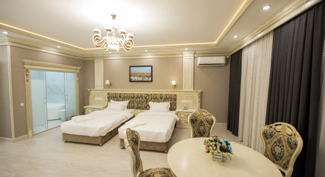 Четырёхместный люкс Royal с красивым видом из окна Simma Hotel Spa & Waterpark
