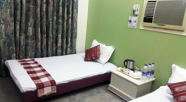 Кровать в общем номере Abode Homestay