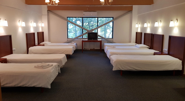 Кровать в общем номере Happy Inn Hotel Alpiyskiy