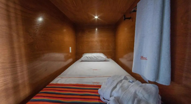 Łóżko w pokoju wieloosobowym z widokiem OYO Hostal Mich
