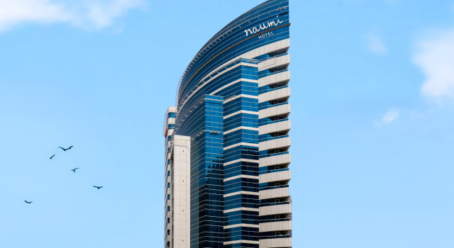 Отель Naumi Dubai