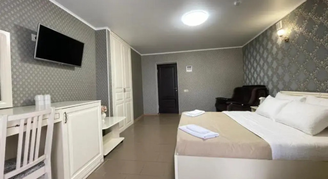 Четырёхместный номер Deluxe с балконом Отель Берег Ямала