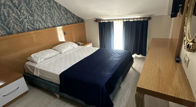 Пятиместный семейный люкс с балконом и с красивым видом из окна serenity suit family otel konyaaltı