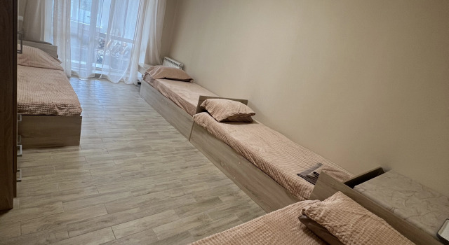 Кровать в общем номере Гостевой дом Ника