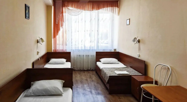 Кровать в общем номере Отель Smart Hotel Миасс