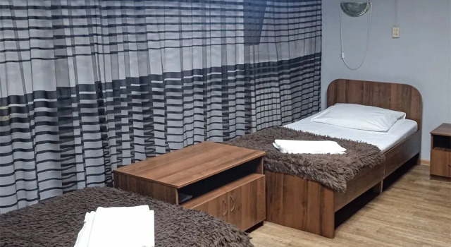 Кровать в общем номере Отель Smart Hotel Нерюнгри