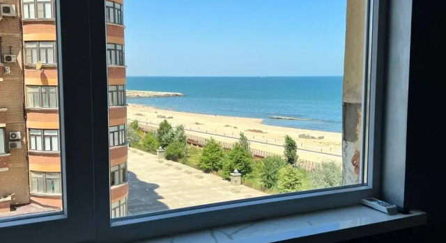 Апартаменты Deluxe с балконом и с видом на море Апартаменты На берегу Моря