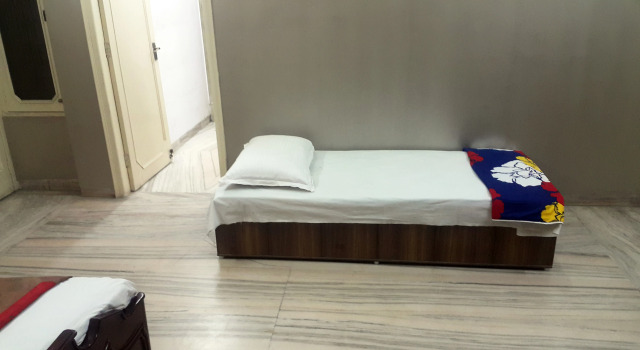 Кровать в общем номере Abode Homestay