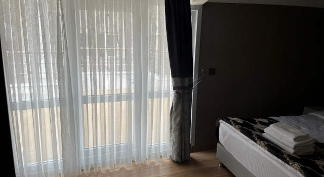 Семейный люкс с балконом и с видом на море H&L Suites
