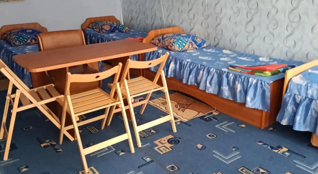 Кровать в общем номере Гостевой дом Чайка