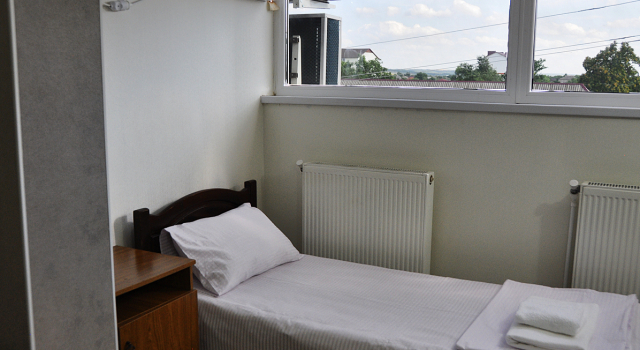 Кровать в общем номере MEDELEAN HOTEL