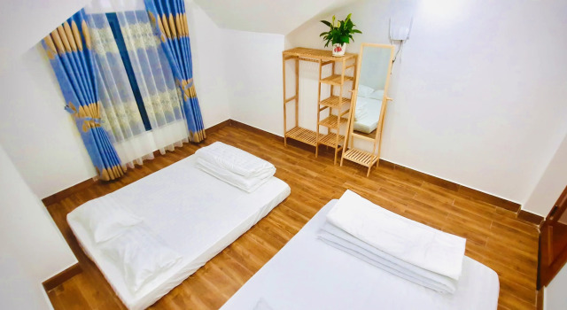 Четырёхместный номер Deluxe с красивым видом из окна Family Homestay Dalat Casa