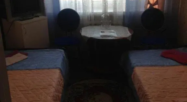 Кровать в общем номере Отель Горняк