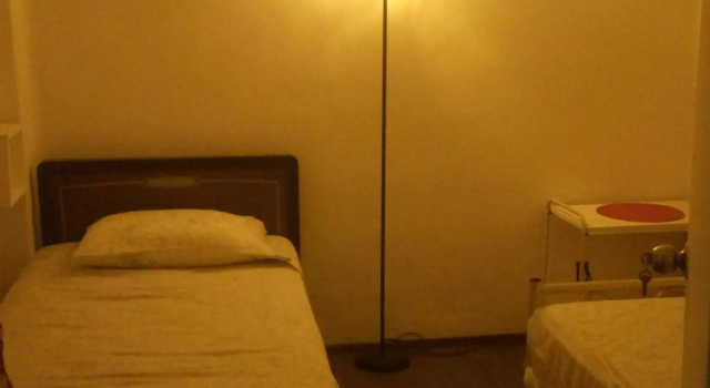 Кровать в общем номере Casa Alucarda