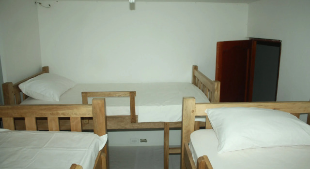 Кровать в общем номере Hostal Casa Micaela