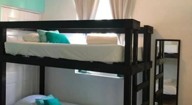 Кровать в общем номере Las Tres Palmas Hotel