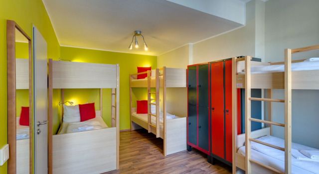 Кровать в общем номере Sonata City Hotel