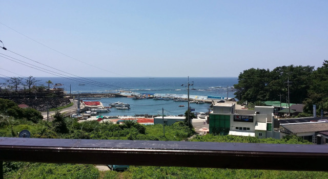 Кровать в общем номере JEJU Doldam B&B