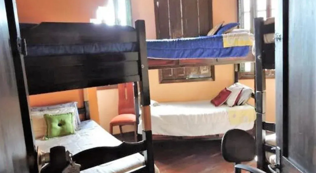 Кровать в общем номере Hostal Casa Quevedo