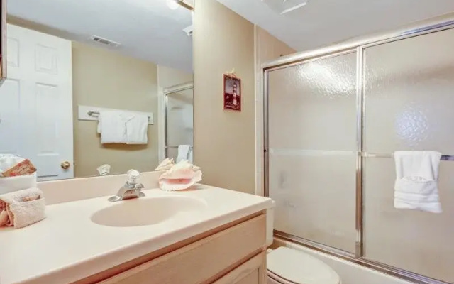 Coast View Condo Featuring Large Windows Overlooking the Beach by RedAwning