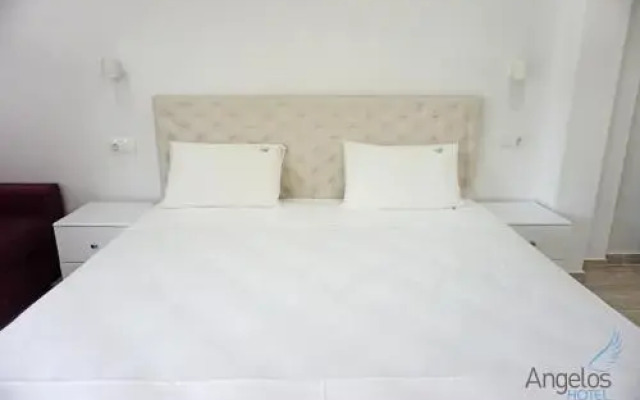 Angelos Hotel комната для гостей