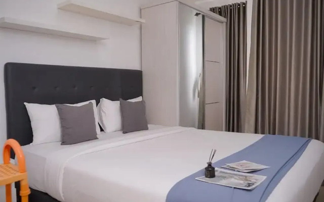 Comfortable and Warm Studio at Poris 88 Apartment