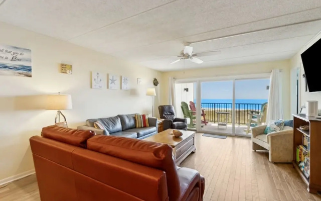 Oceanfront Beach Condo with Private Balcony, Short Walk to Pool and Beach by RedAwning