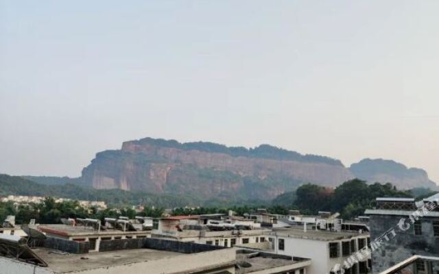 Danxia Mountain Xinnongmin Hostel Китай, Шаогуань - отзывы, цены и фото номеров - забронировать отель Danxia Mountain Xinnongmin Hostel онлайн вид на фасад