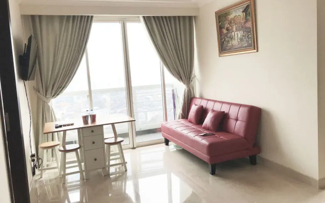 Luminous 2 Bedrooms at Menteng Park Apartment by Travelio