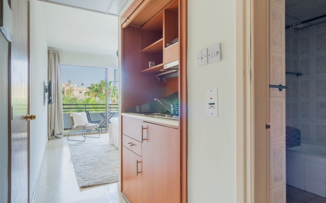 Studio with balcony and garden view