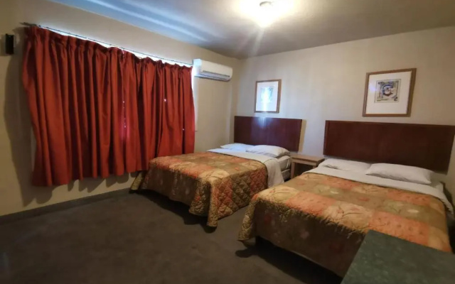Capital O Baja Place Inn