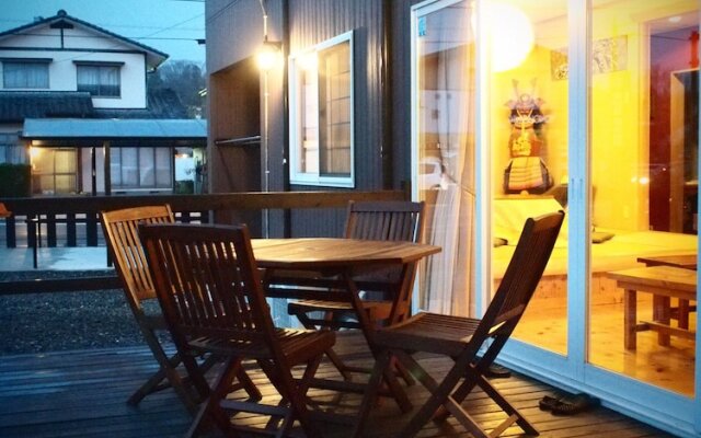 Отель Aso Base Backpackers Минамиогуни вид на фасад