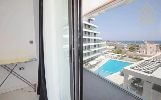 Апартаменты Stylish 1BR Sea View in Longbeach Iskele