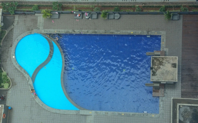 1 Bedroom at Green Pramuka Apartment by Travelio