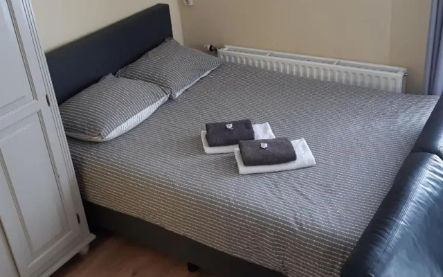 Logement De witte klok