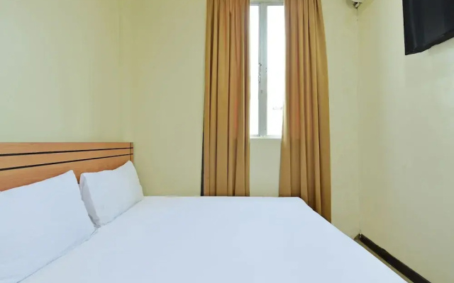 SPOT ON 92255 Lucky Guesthouse
