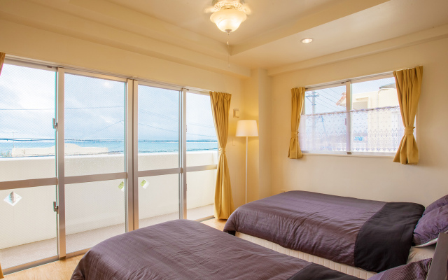 Отель Kariyushi Condominium Resort Kin Beach Side House Gracia Центр Окинавы комната для гостей