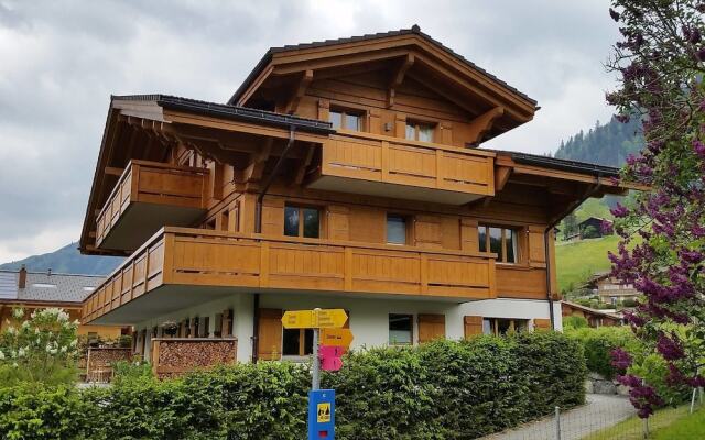 Апартаменты Gstaad Perfect Winter Luxury Apartment вид на фасад
