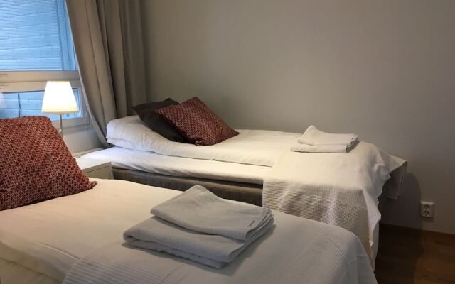 Апартаменты Kotimaailma Apartments Joensuu Йоенсуу комната для гостей