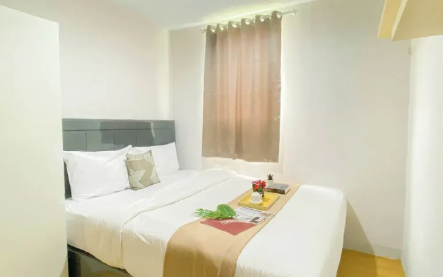 Simple 2Br At Azalea Suites Apartment