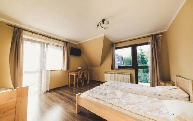 Отель Pokoje i Apartamenty Nad Potokiem Закопане комната для гостей