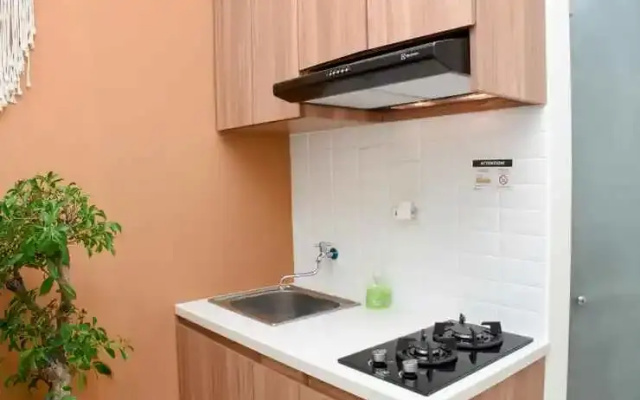 2BR Green Pramuka City Apartment by Travelio