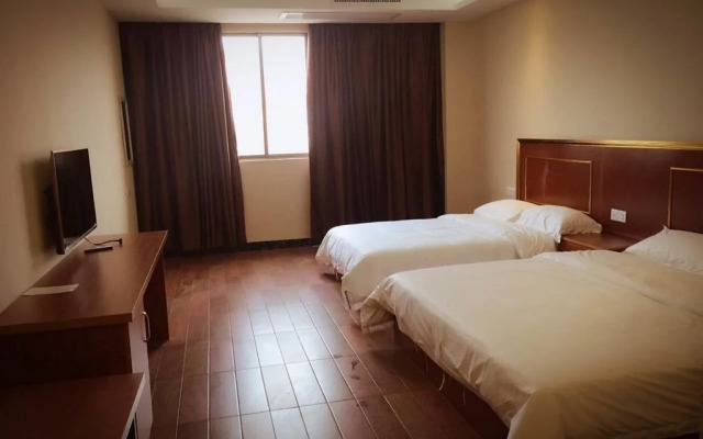Q+ Nanxiong Xinhewan Business Hotel